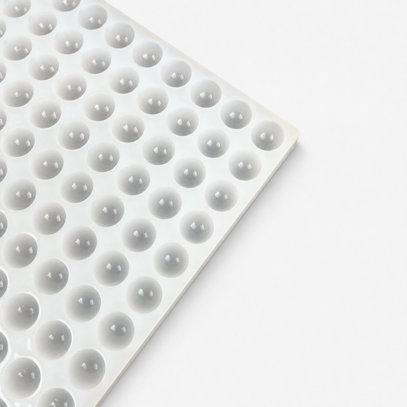 Close-up of the half-sphere cavities on a 2.8mL commercial silicone gummy mold