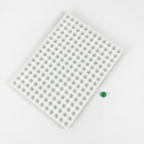 Diagonal view of the 2.8mL half-sphere silicone mold with an emerald green gummy sample