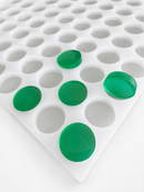 3.8mL coin gummy mold with 130 cavities and emerald green round gummies