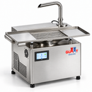 Angle view of Gummy Molds 5.5L desktop chocolate tempering machine with stainless steel vibration table